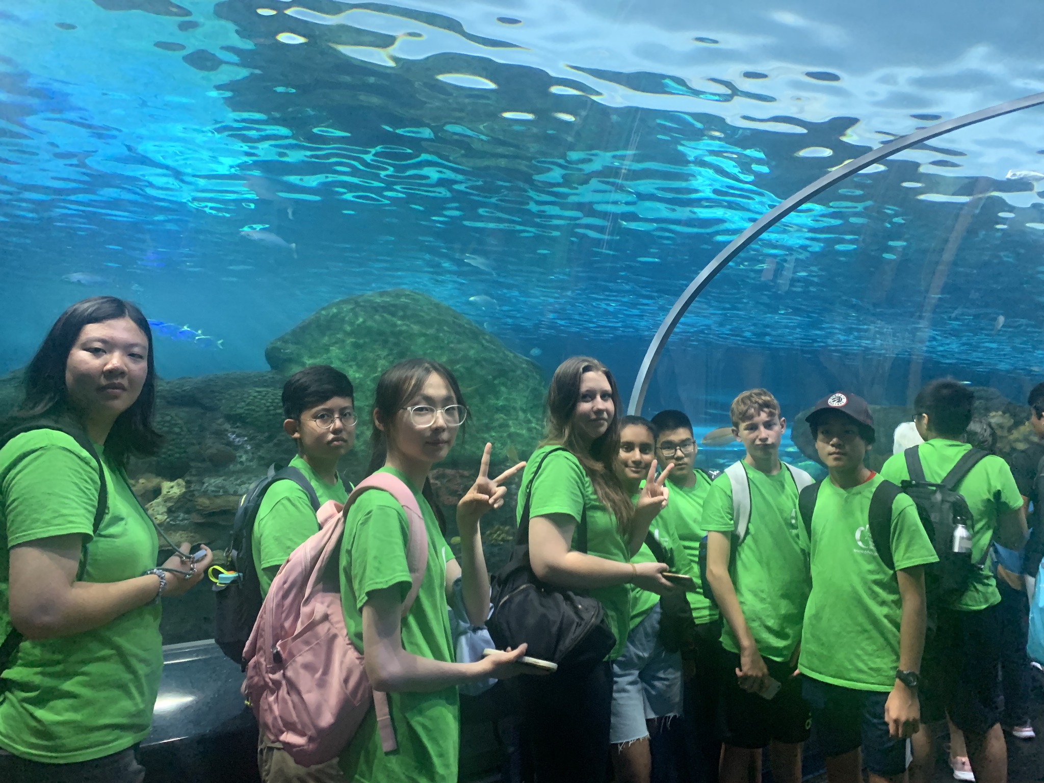 Group of students standing in front of an aquarium at Ripley